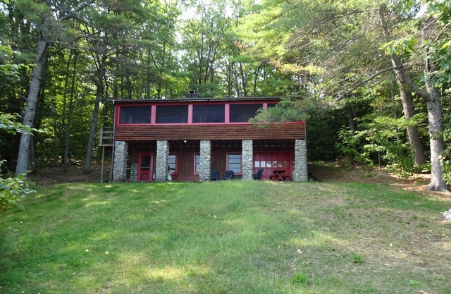 Pet friendly, cozy Maine log cabin surrounded by woods with beautiful views!