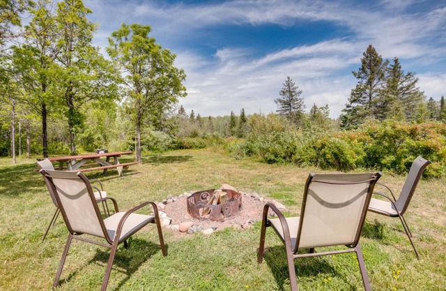 Pet-Friendly Iron River Cabin with Fire Pit!