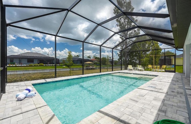 Pool overlooking canal, Outdoor Grilling station - Villa Sand Dollar Siesta