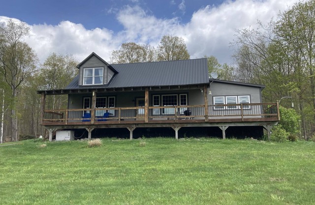 Post/ Beam farmhouse with gorgeous views, a hot tub, no cleaning fees and sheep!