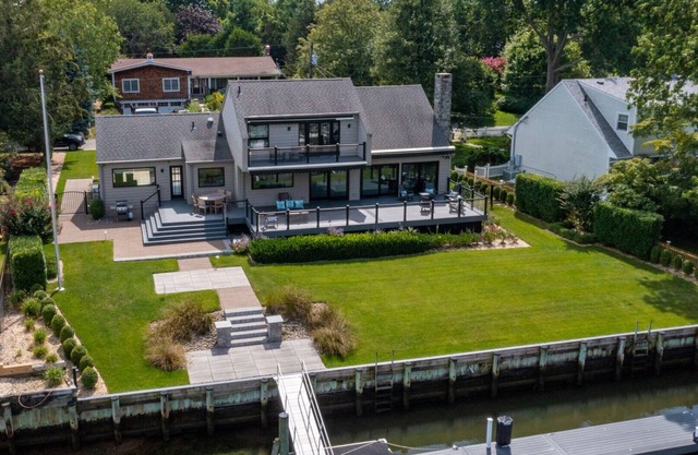 Pristine waterfront home with direct access to private bay and dock,...