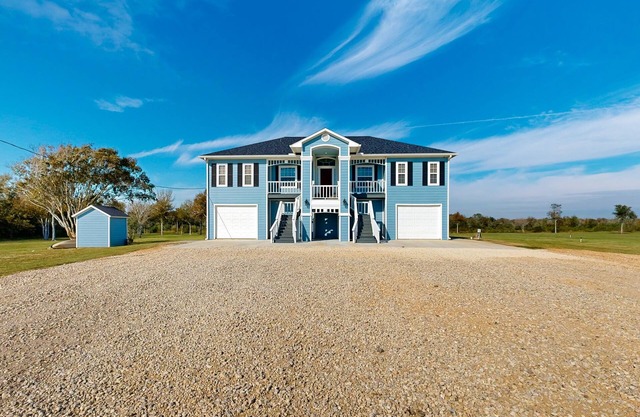 Private acreage next to the bayou with kayaks, porches, open layout, W/D, & AC