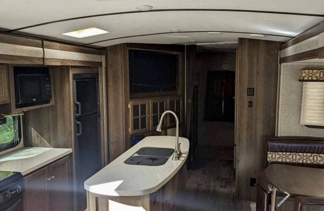 Private camp site on Sand Pond, nicely furnished RV & your own private dock!