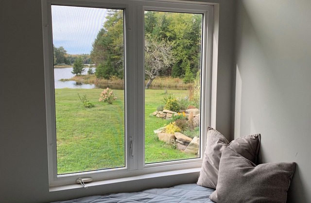 Private cottage on 8 wooded and flower-filled acres at Lake Wentworth and the Wentworth River