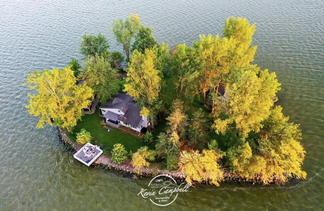 Private Island! Includes house, cottage, boat docks, best sunsets on Indian Lake
