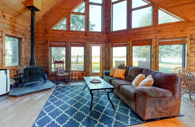 Private island getaway with beach access, lake views, wood stove, and WiFi