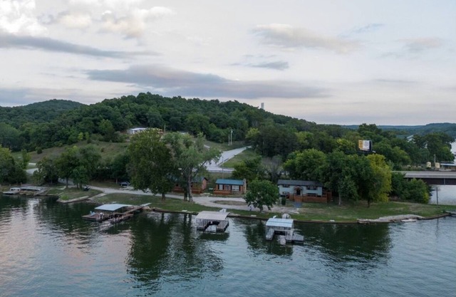 Private Island Retreat with 500' Level Lakefront & 3 Houses with Private Docks!!