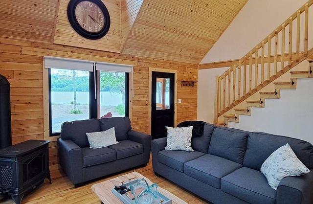 Private lakefront log cabin with year-round hot tub.