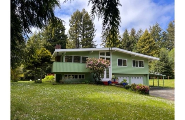 Private mid-century modern hideaway in forest near the river and sea.