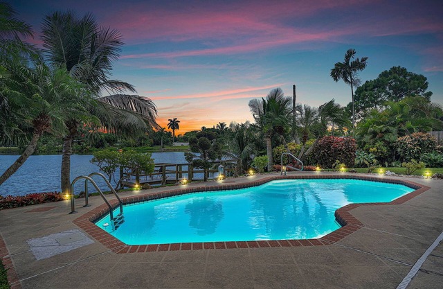 4 bed 3 bath private lakefront home, with heated saltwater pool. Close to beach.