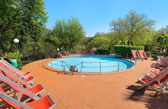 Property in a Holiday Village "Via Delle Rose 38" with Terrace, Garden & Shared Pool