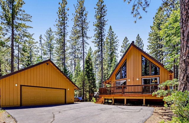 Quaint dog-friendly cabin in the woods with hot tub, deck, grill, & private W/D