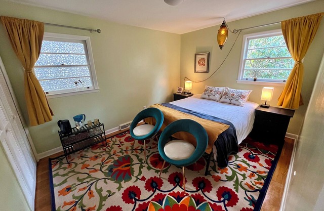 Quiet bungalow in west Asheville with hot tub, fitness room, and a wood stove.
