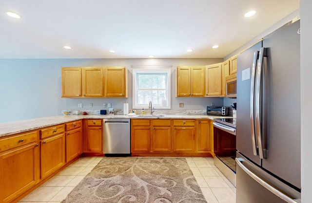 Quiet home near outdoor recreation with open layout, full kitchen, W/D, & patio