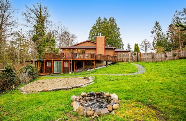Quiet & secluded getaway with backyard, firepit, wraparound deck & wood stove
