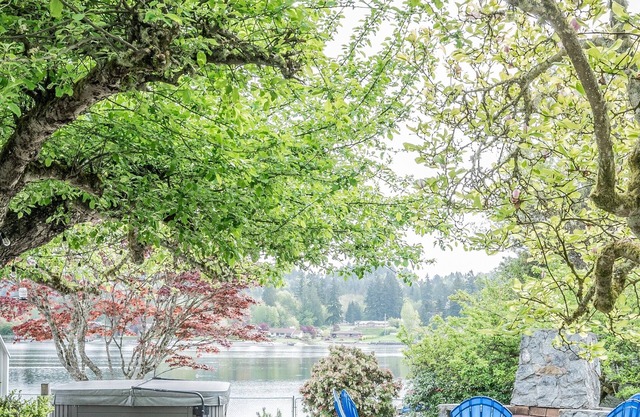 Quiet Waterfront Home with outdoor fireplace, HOTUB & private beachfront