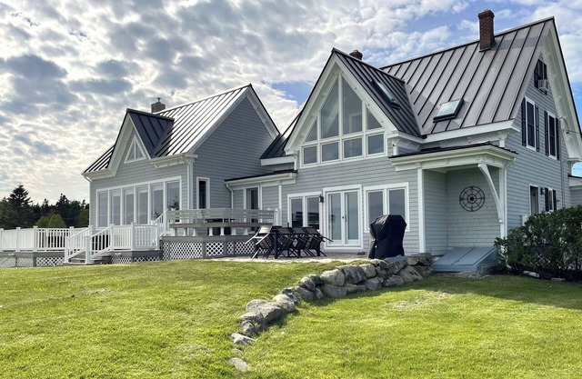 Quintessential waterfront home with over 400 feet of private sandy beach.