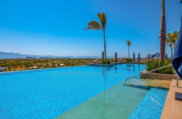 Radiant retreat full of color, modern fixtures, & scenic balcony - rooftop pool