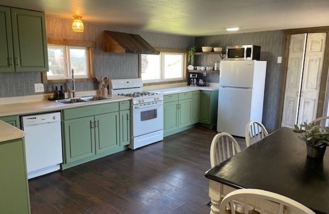 Recently remodeled family home with large fenced in back yard, Full size kitchen, 2 full bathrooms, Bedroom 1 has a king size bed, Bedroom 2 has a queen size bed. The flex space has a trundle bed with 2 twins.