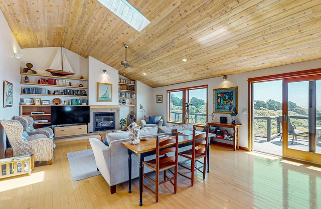 Rejuvenate in this home with fire place, hot tub, ocean/lighthouse/sunset views