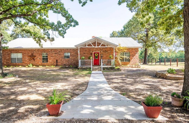 Relax and enjoy the peace & quiet at this spacious ranch on 30 plus acres.