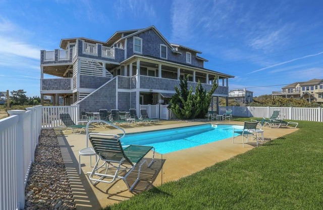 Relax and unwind from this 5BR home w/Private Pool & private walkway to beach!