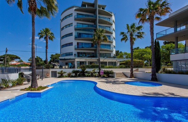 Relax by the pool at this Algarve apartment gem.