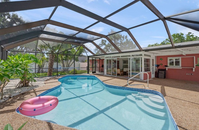 Relax in style at Coral Breeze! Your private Sarasota escape | Heated pool | Sunroom | Dog-friendly
