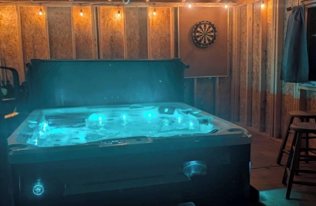 Relax with an enclosed hot tub and cozy island vibes in the heart of Summerside