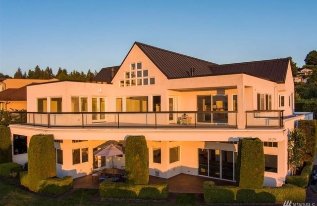 Relaxing in an Entire 5,400sf Beach View Home With Indoor Heated Swimming Pool.