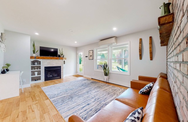 Relaxing two-story home with a deck, firepit, game room, & washer/dryer