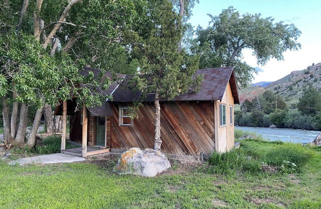 Remodeled Cabin on 40 private acres of Wind River frontage with R/V hookup.