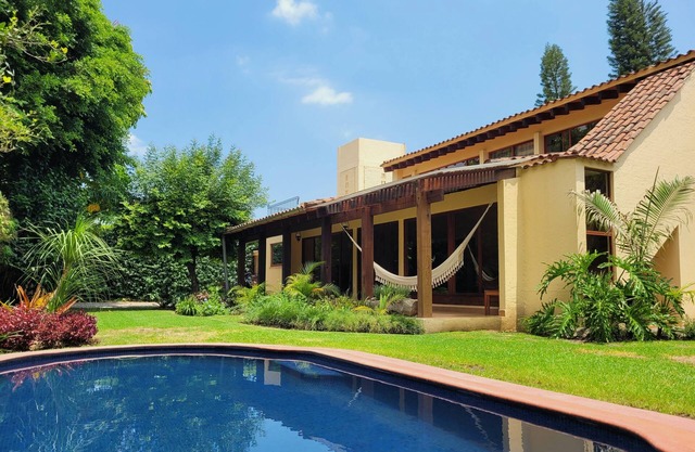 Remodeled colonial style home, tranquil garden w/pool!
