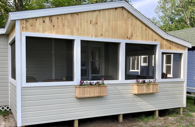 Remodeled lakefront cottage w/ marina, firepit, swimming area.