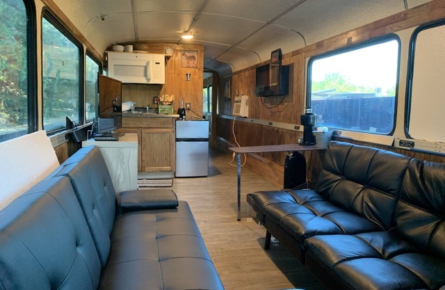 Renovated coach bus overlooking equestrian and plantation properties.