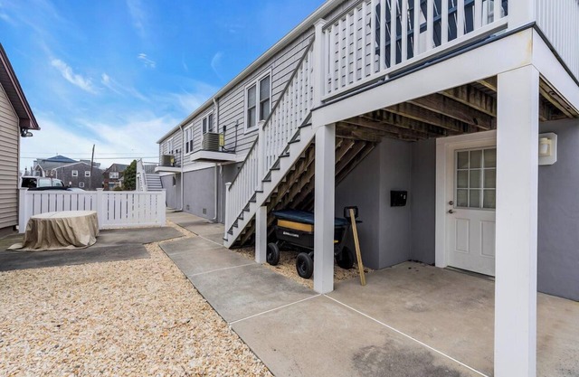 Renovated, open concept 1BR unit w/ porch room, futon in LR, huge basement, 2 badges to beach!
