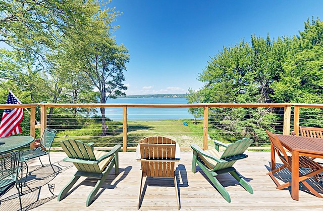 Renovated waterfront cottage with expansive deck, multiple fireplaces, & grill