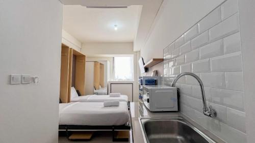 Restful Studio (No Kitchen) Apartment at Bandaraya - Tallasa City Makassar By Travelio