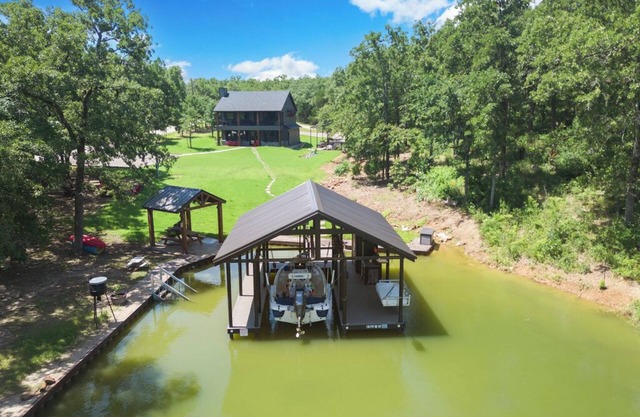 Richland Chambers Lakefront 2-story home with boat dock and pavilions.