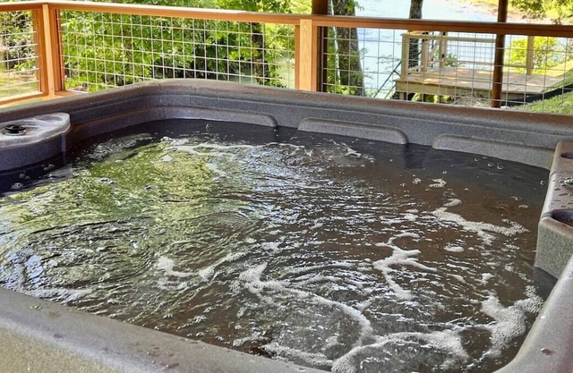 Rustic River Cabin - private hot tub, waterfront, fire pit on the Caddo River
