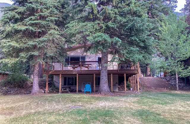 Riverfront cabin with large yard, great deck, & fireplace