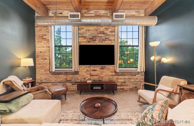 Riverfront Condo for Professionals with Workspace & Prime Medical Mile Access.