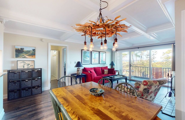 Riverfront condo with beach access to lake, fireplace, furnished deck & cable