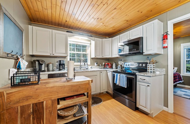 Riverfront oasis with hot tub, firepit, game room, & trail access - dog-friendly