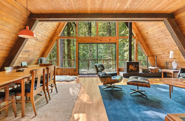 Riverside A-frame in gated cabin community with private deck, woodstove, & W/D