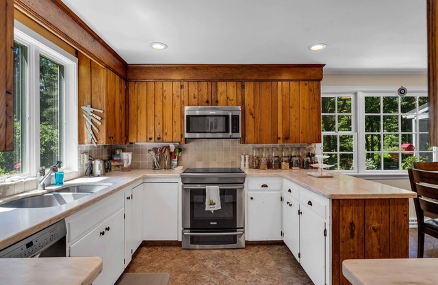 Romantic colonial in beach town situated on park-like private 8 acres with pool.