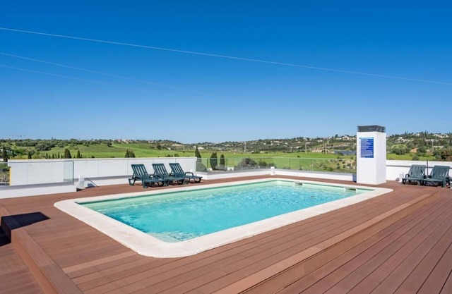 Rooftop pool, balcony and AC