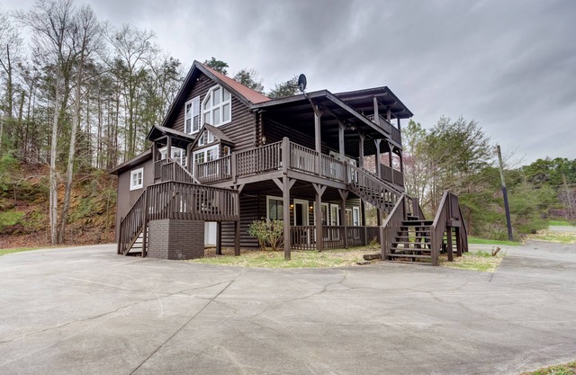 Roomy, three-story mountain home with two full kitchens, game rooms, & AC