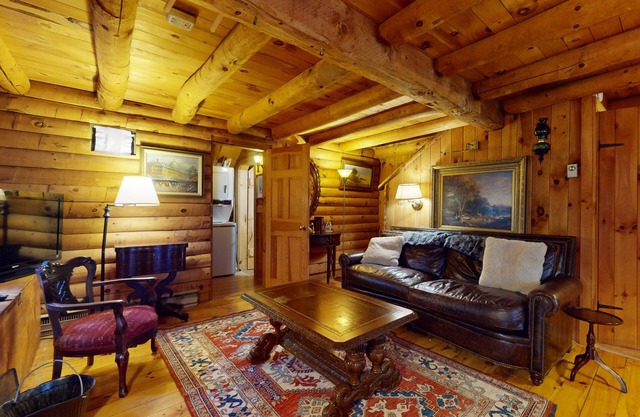 Rustic cabin in serene location with fireplace and pool access