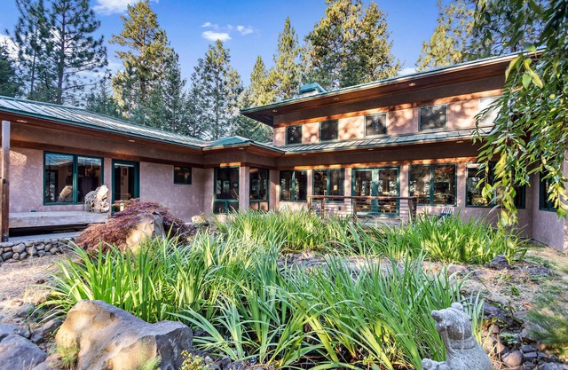 Rustic contemporary in a private forest setting overlooking Lake Coeur d’Alene